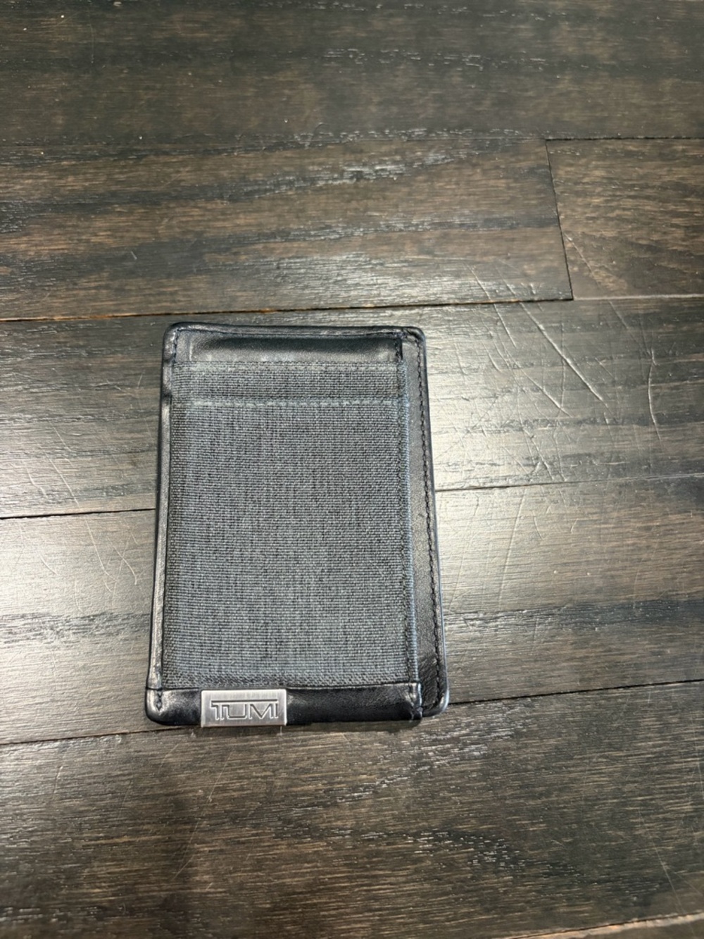Tumi Black Elastic Card Sleeve with Silver Logo Plate